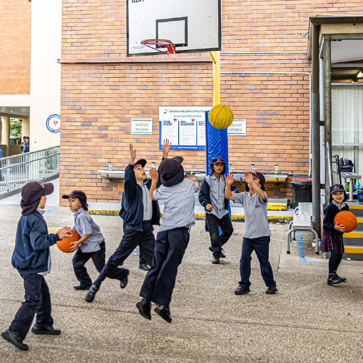 Sacred Heart Catholic Primary School Westmead students playing basketball