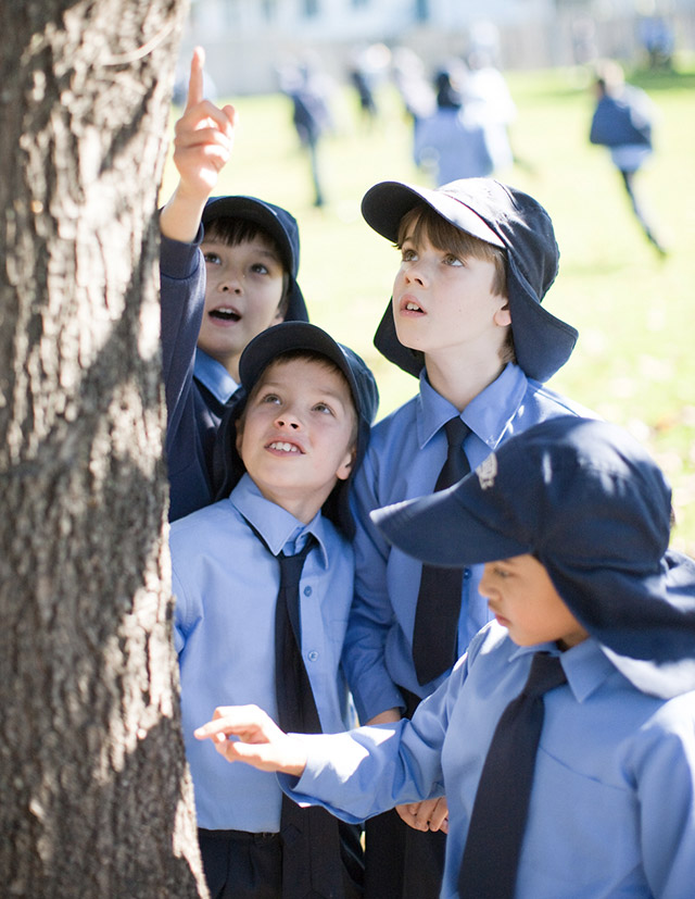 Older photo of students on Sacred Heart Catholic Primary School Westmead lawn